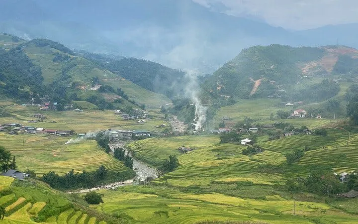 Sapa rice terraces with village and hot spring in the valley, Vietnam.
