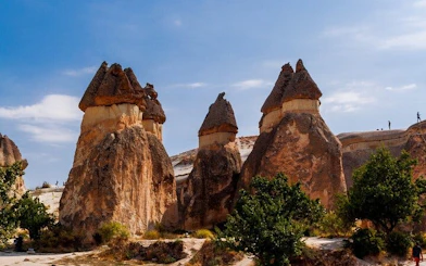 Cappadocia rock formations under blue sky during private museum tour.