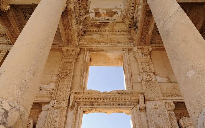 Ancient ruins of Ephesus with detailed stone carvings and columns.