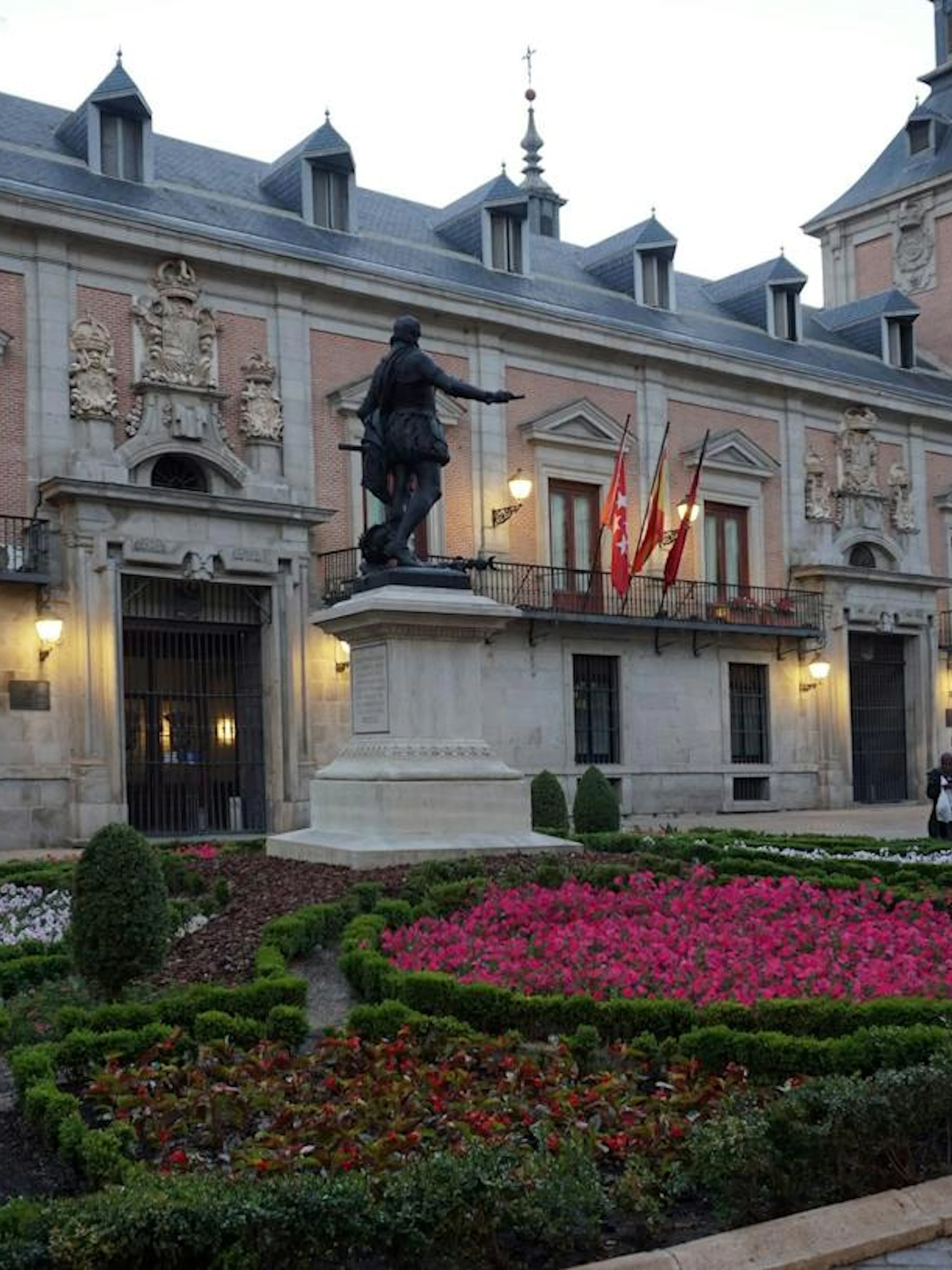 Statue and gardens at Plaza de la Villa in Madrid's historic center.