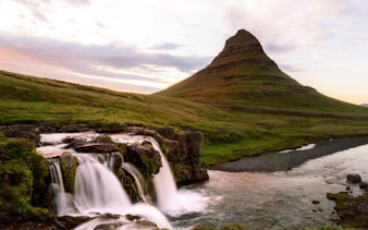 Kirkjufell mountain and waterfall in Iceland during a self-guided walking tour.