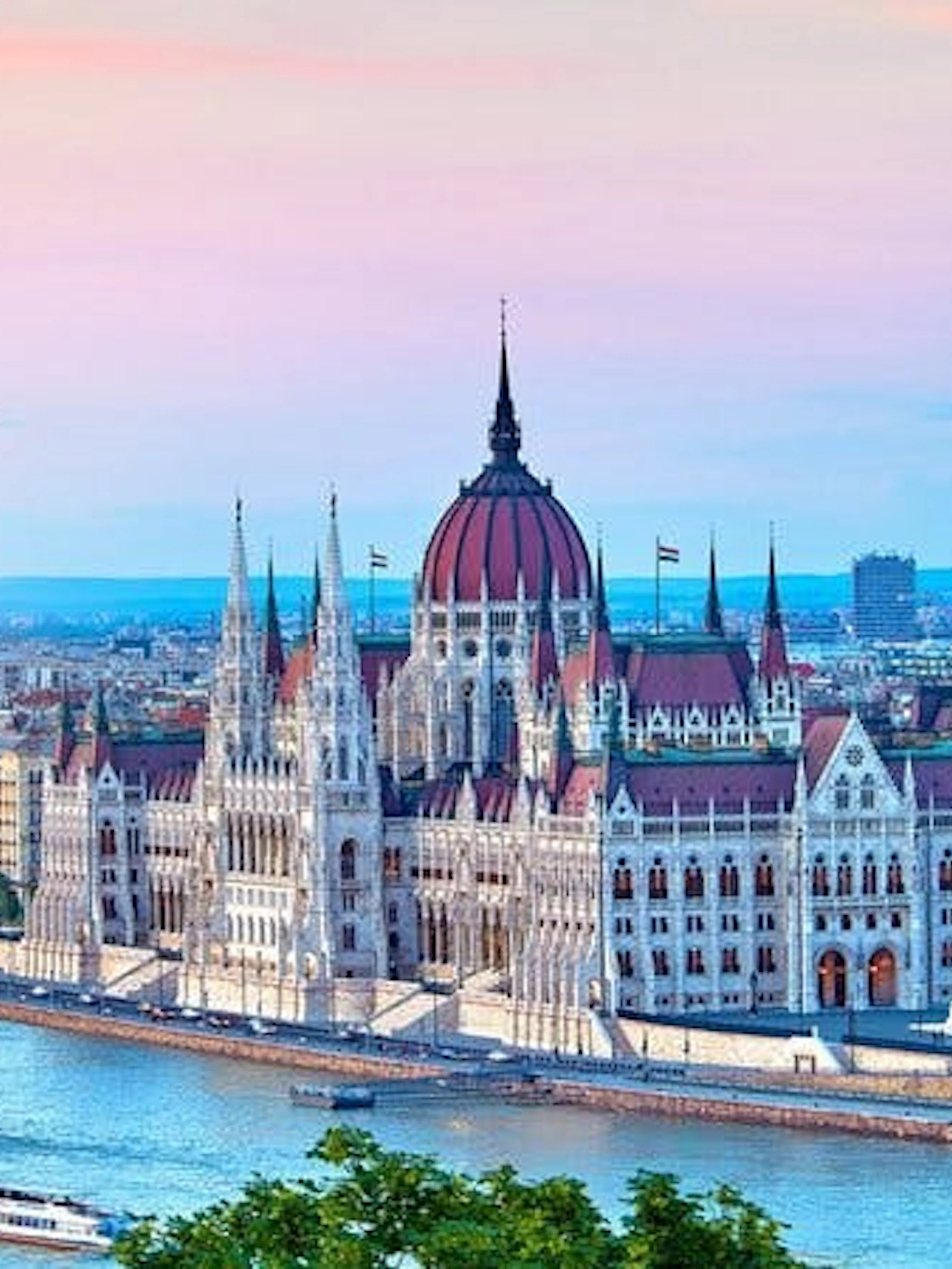Hungarian Parliament Building along the Danube River in Budapest during a self-guided walking tour.