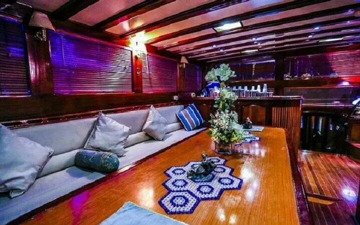 Luxurious boat interior with dining setup for belly dancing party, Sharm El Sheikh.
