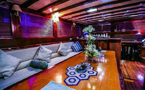Luxurious boat interior with dining setup for belly dancing party, Sharm El Sheikh.