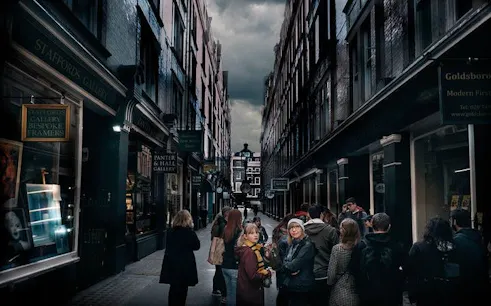 Walking tour group exploring Harry Potter filming locations in a narrow London alley.