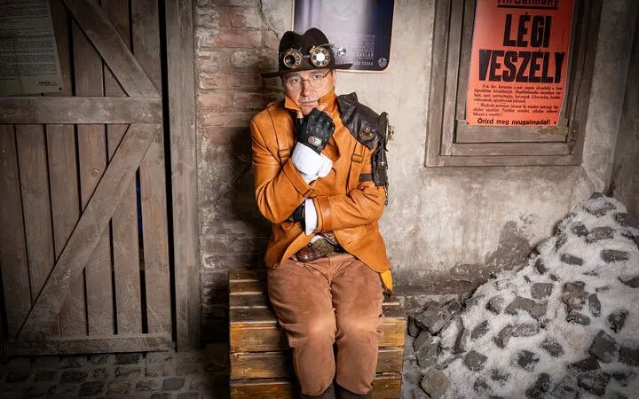 Steampunk character in leather attire at Time Machine Budapest exhibition.