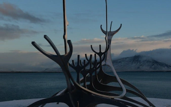 Sun Voyager sculpture by the sea in Reykjavik during a guided walking tour.