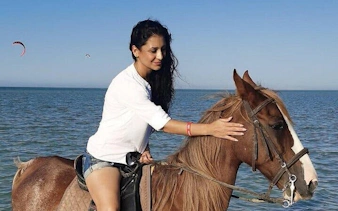 Horseback riding along Red Sea beach in Hurghada.