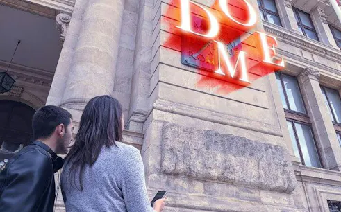 Couple using phone for self-guided city exploration game in Washington DC.