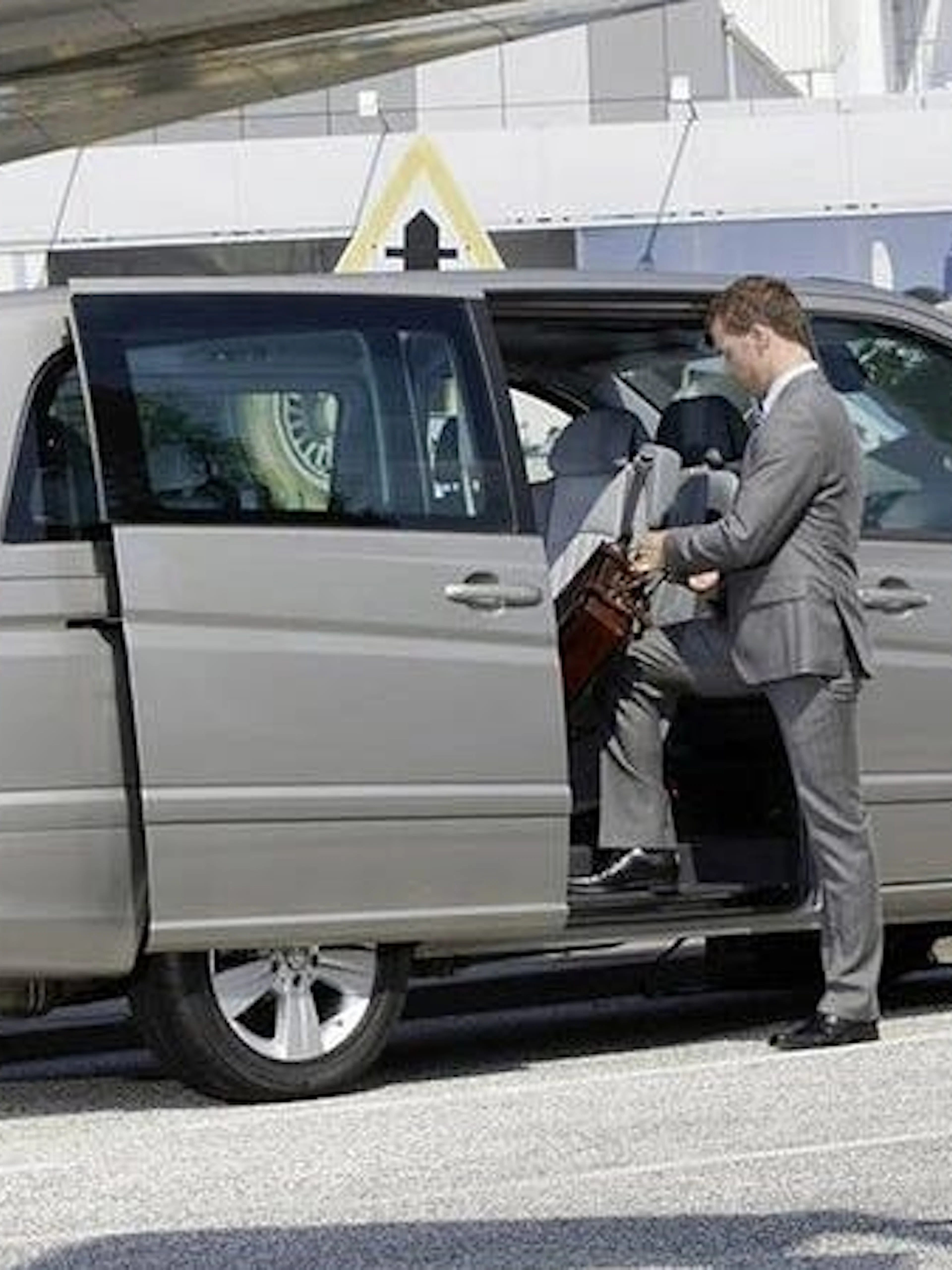 Private transfer service vehicle with driver and passenger, Taghazout to Marrakesh.