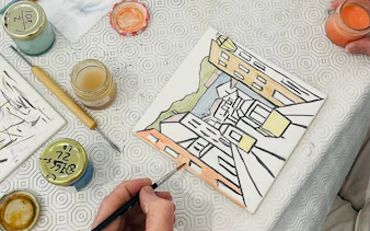 Lisbon tile painting in progress at artist's studio with local guidance.