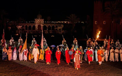 Performers in traditional attire at Chez Ali Folklore Show, Marrakesh.