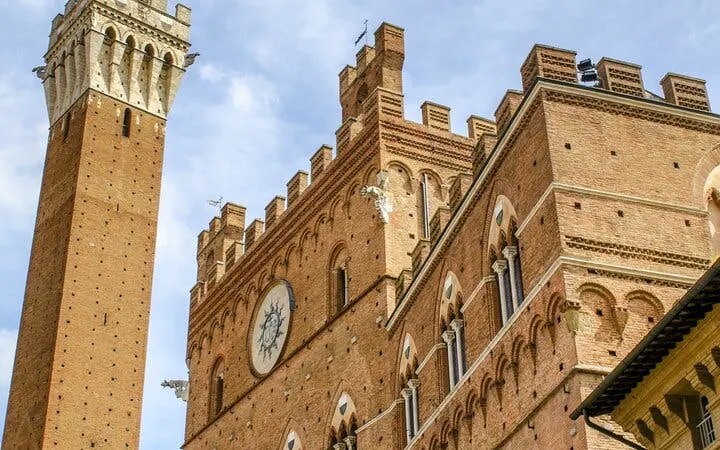 Torre del Mangia and Palazzo Pubblico in Siena, Italy, part of the self-guided city exploration game.