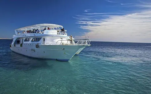 Boat on clear waters for scuba diving tour, Sharm El Sheikh.