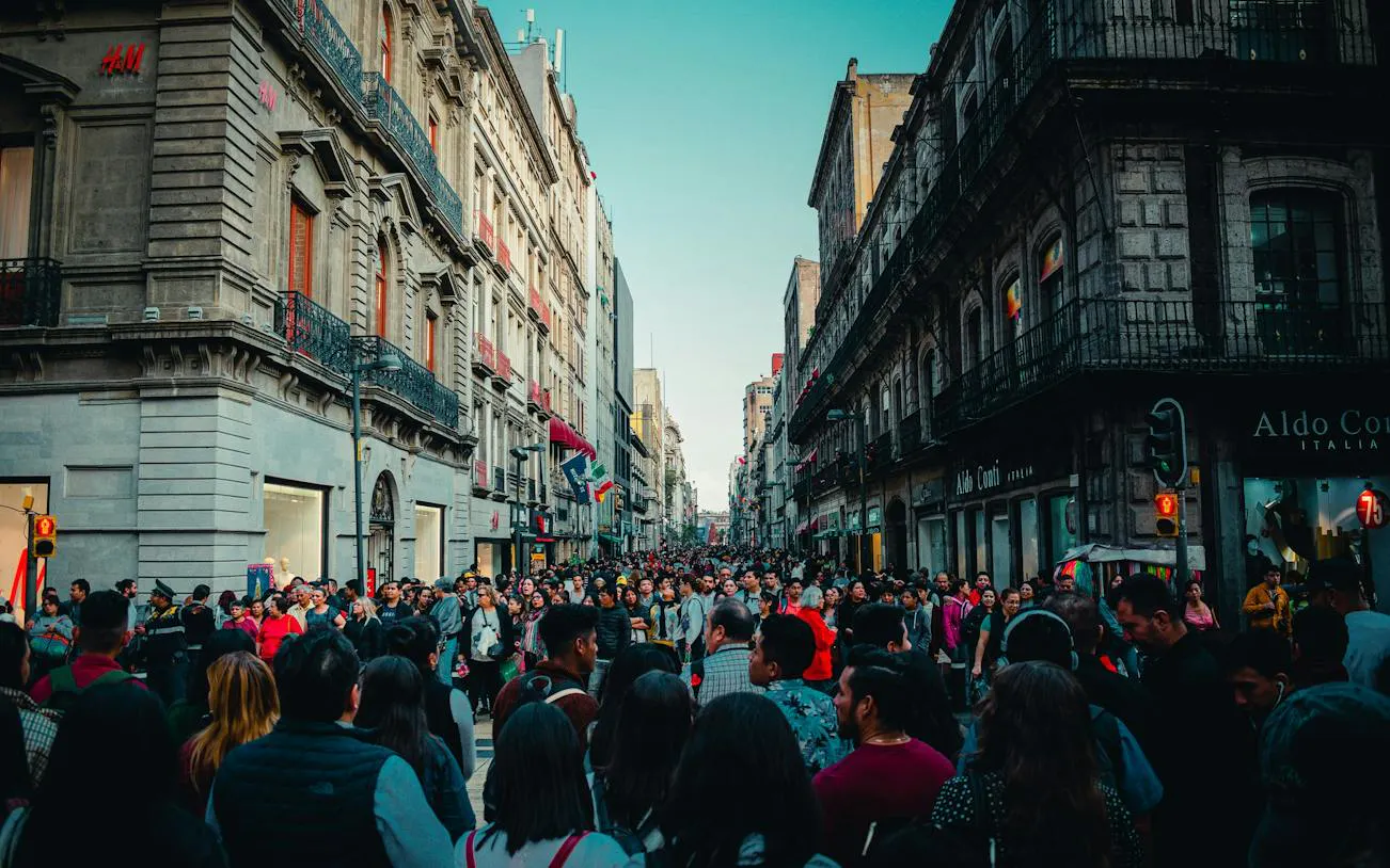 Crowded street in Mexico City's Centro Histórico during a self-guided audio walking tour.
