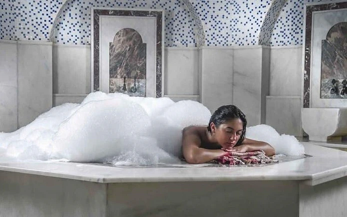 Traditional Moroccan hammam with marble interior in Marrakech.