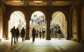 Bethesda Terrace arches with people walking, Central Park, New York, self-guided audio tour.