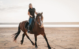Horseback riding on a sandy beach near the Red Sea in Hurghada.