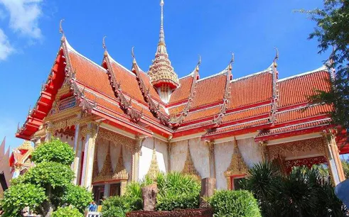 Wat Chalong temple with ornate red roof and spires, Phuket City tour.