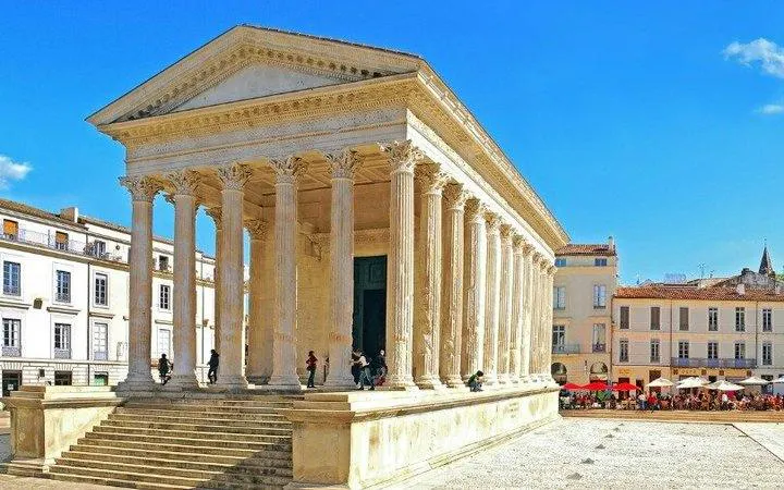Roman temple in Nîmes with Corinthian columns, part of self-guided audio walking tour from Arles.