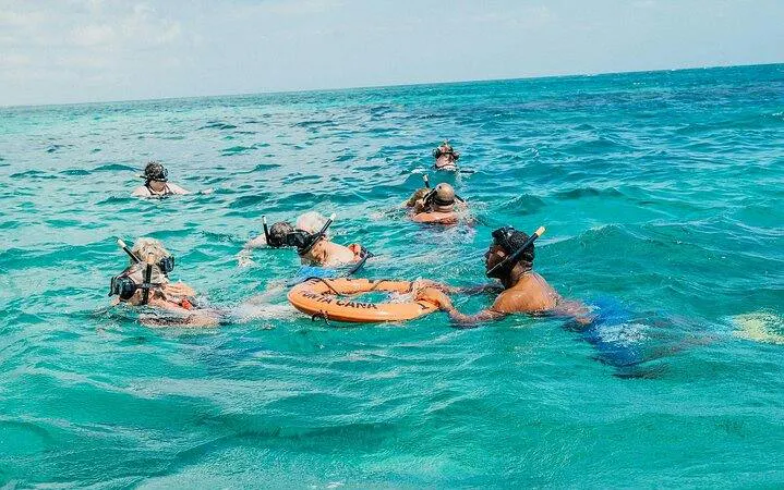 Snorkelers in the ocean during a catamaran cruise in Punta Cana.