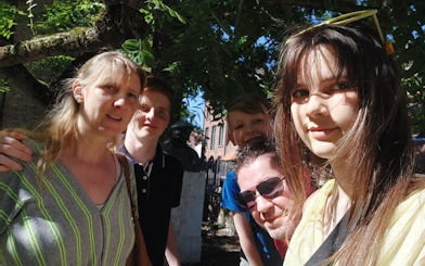 Group enjoying a sunny day in Bruges during a self-guided city exploration game.