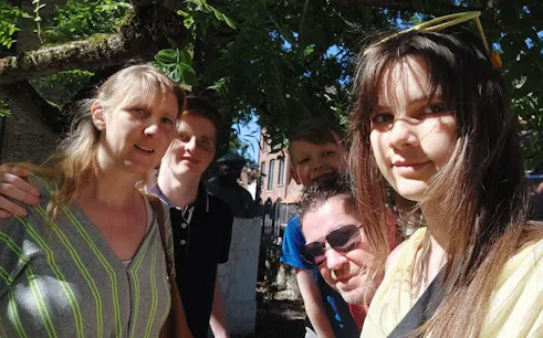 Group enjoying a sunny day in Bruges during a self-guided city exploration game.
