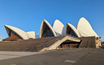 Sydney Opera House exterior with iconic sails, part of self-guided audio walking tour from The Rocks.