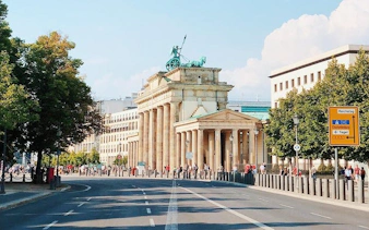 Brandenburg Gate in Berlin on a sunny day, part of the Berlin Wall Greatest Escapes tour.