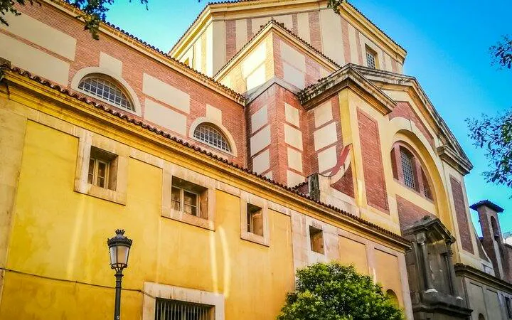 Historic building facade in Madrid, part of Don Quixote's self-guided city exploration game.