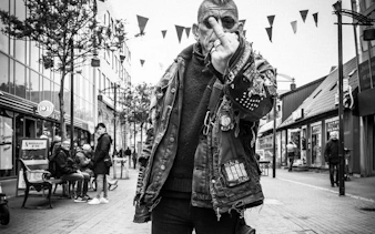 Reykjavik street scene with punk culture enthusiast during guided walking tour.