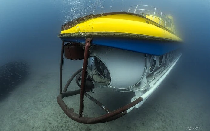 Submarine exploring underwater near Tenerife with hotel pickup option.