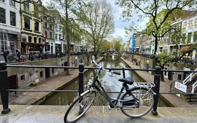 Bicycle on bridge over canal in Utrecht during self-guided walking tour.
