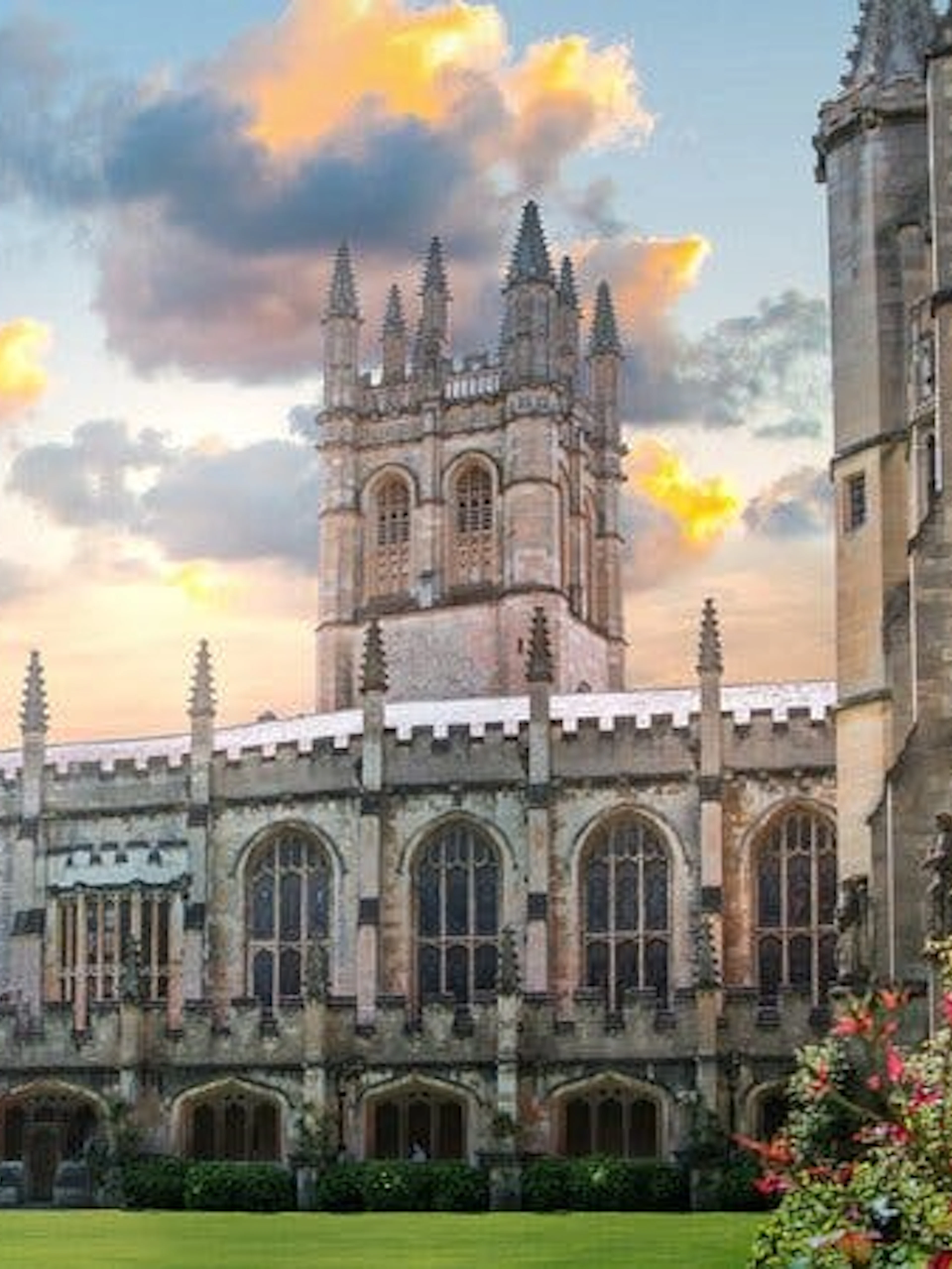 Oxford college courtyard with historic architecture during sunset.