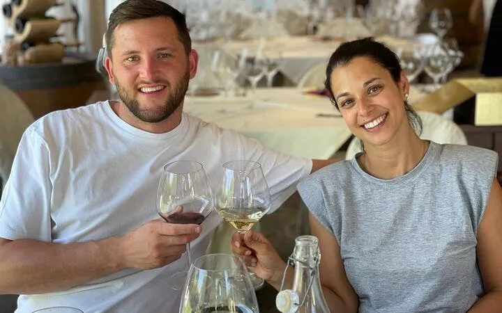 Couple enjoying wine tasting during Private Chianti Vespa Tour in Tuscany.