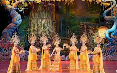 Performers in traditional costumes on stage at Alcazar Cabaret Show, Pattaya.