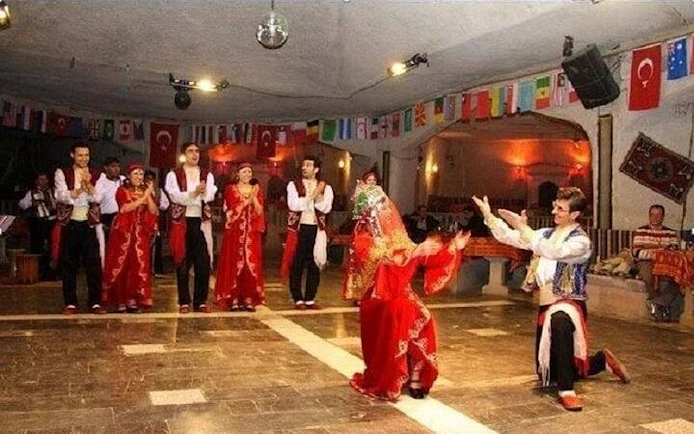 Traditional dance performance at Hot Nights Live Cabaret, Hurghada, with dancers in vibrant costumes.
