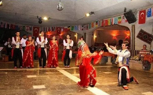 Traditional dance performance at Hot Nights Live Cabaret, Hurghada, with dancers in vibrant costumes.