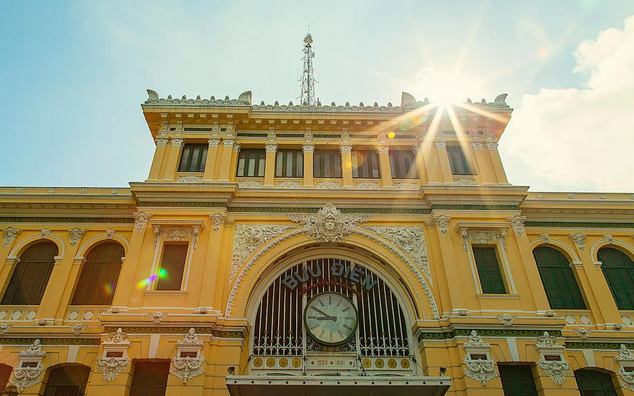 Central Post Office facade in Ho Chi Minh City's French Quarter, featuring ornate architecture.