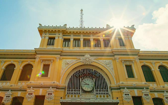 Central Post Office facade in Ho Chi Minh City's French Quarter, featuring ornate architecture.