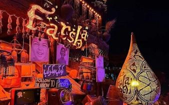 Farsha Cafe entrance with illuminated signs and decor, Sharm El Sheikh.