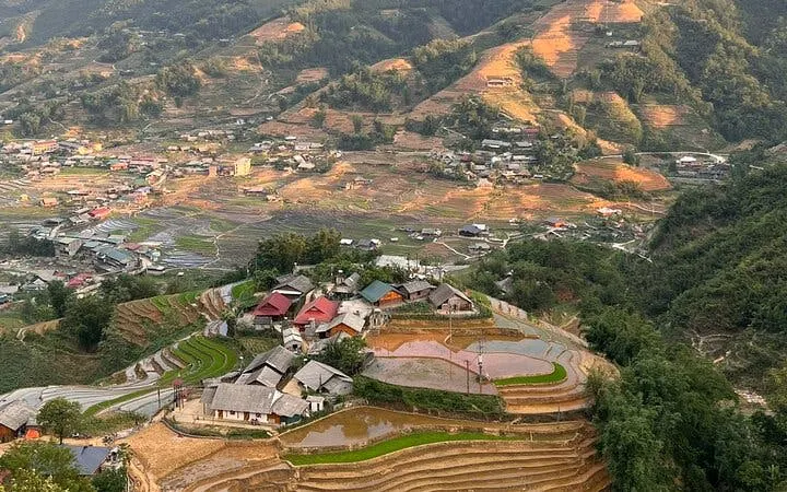 Sapa rice terraces and village view during motorbike tour with hotel pickup.
