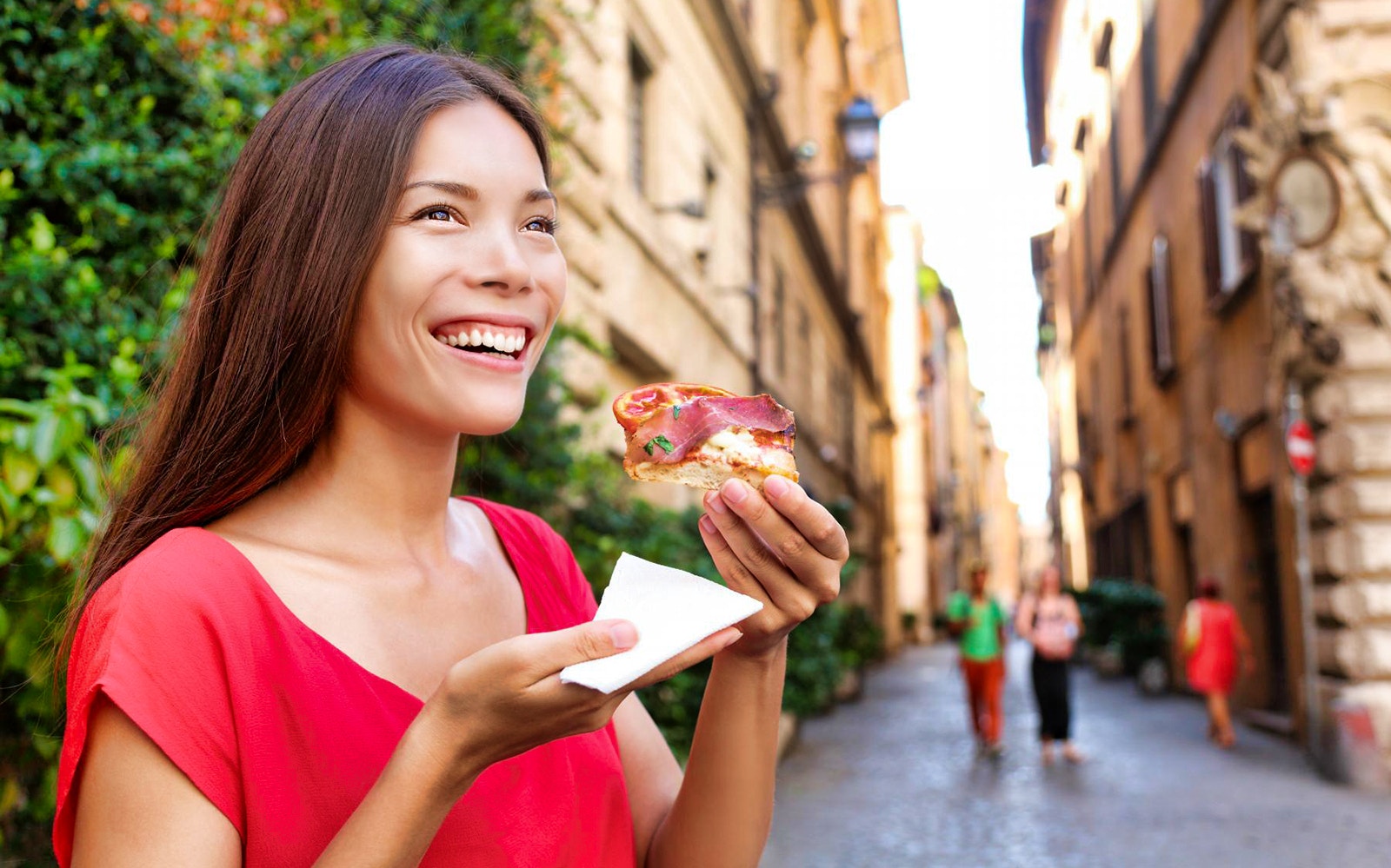 Rome food tour participants sampling local cuisine at an outdoor market.