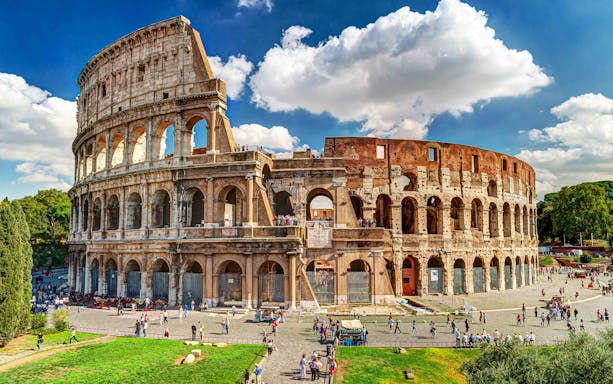 Colosseum exterior with visitors, Rome, part of twilight tour with Imperial Forums.