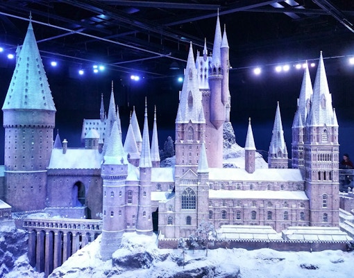 Hogwarts castle model covered in snow, part of the Harry Potter Forbidden Forest tour.