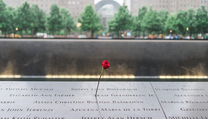 9/11 Museum exterior with visitors at entrance in New York City.