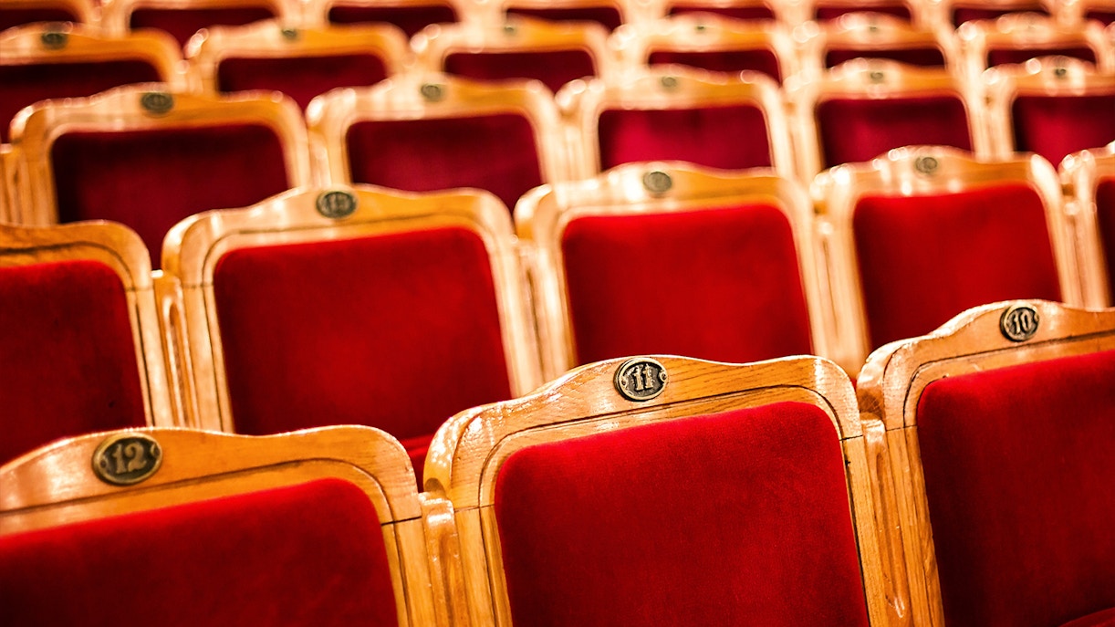 Radio City Music Hall exterior with illuminated marquee in New York City.