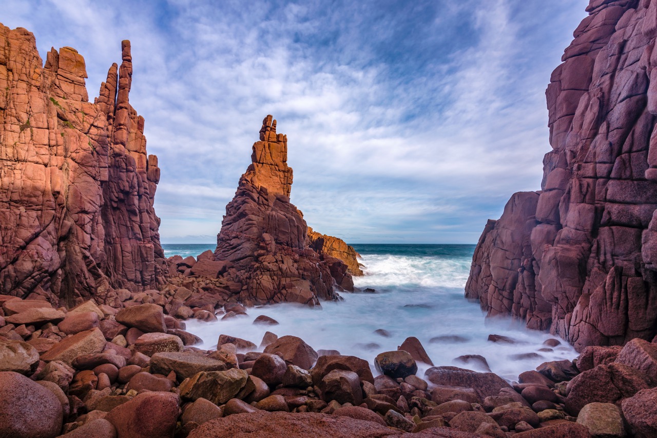 Cape Woolamai coastline view from Phillip Island cruise, featuring rugged cliffs and ocean waves.