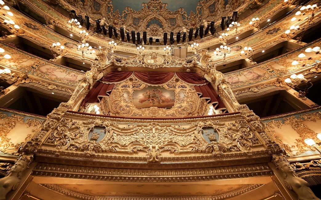 Teatro La Fenice's ornate interior with golden balconies in Venice.