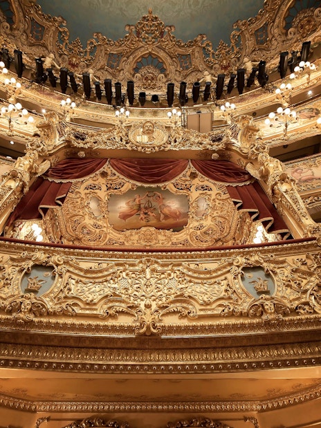Teatro La Fenice's ornate interior with golden balconies in Venice.